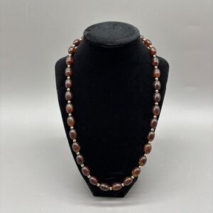 Avon Root Beer Lucite Swirl Bead Necklace Gold Tone Spacers Hidden Clasp 1970s